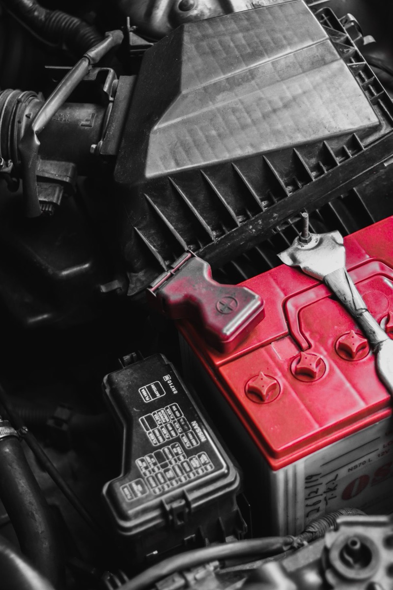 Close-up of a car battery under the hood, stock photo