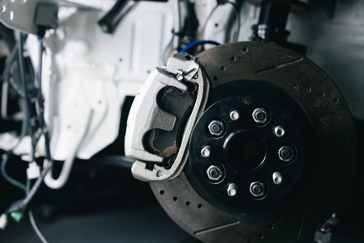 Close-up of a brake caliper and rotor, stock photo